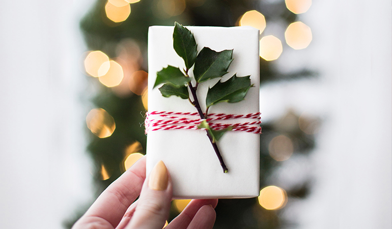Give gifts that won't break the bank. Image of wrapped gift.